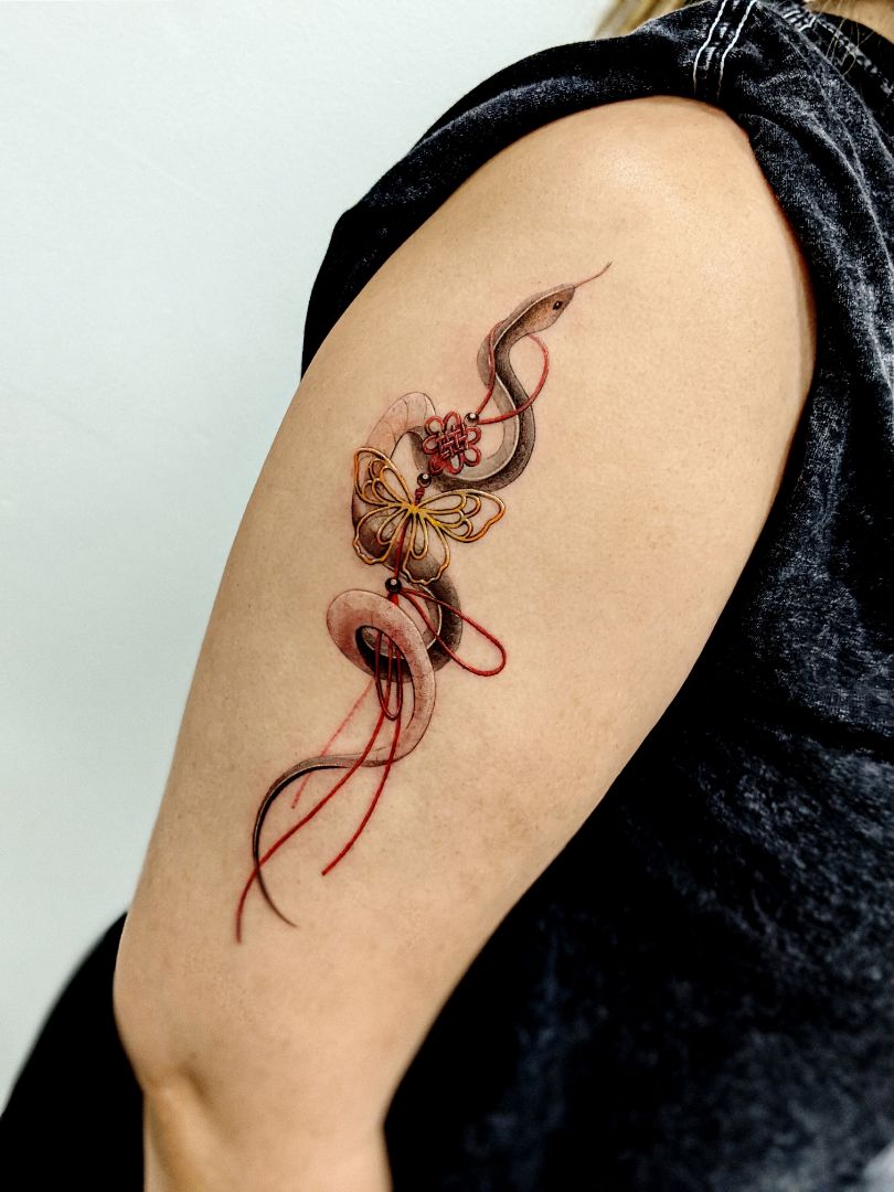snake norigae tattoo