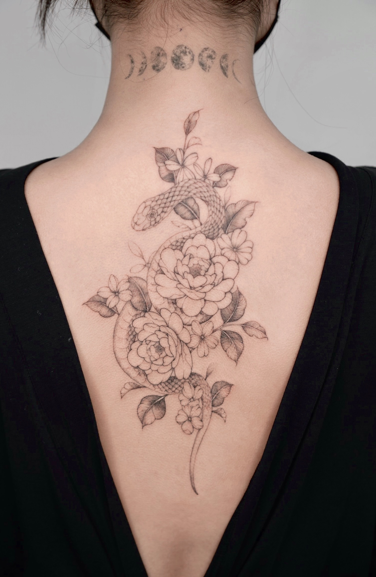 fineline flower snake tattoo